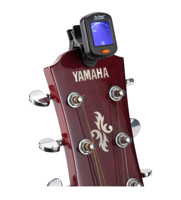 Yamaha guitar headstock with a digital tuner attached on a white background